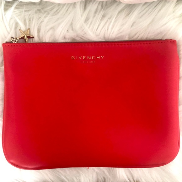 Givenchy Handbags - Givenchy red pouch/clutch with gold star. Adorable. EUC. 9X6